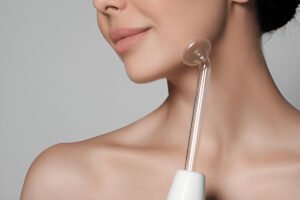 girl using frequency wand for fine lines removal